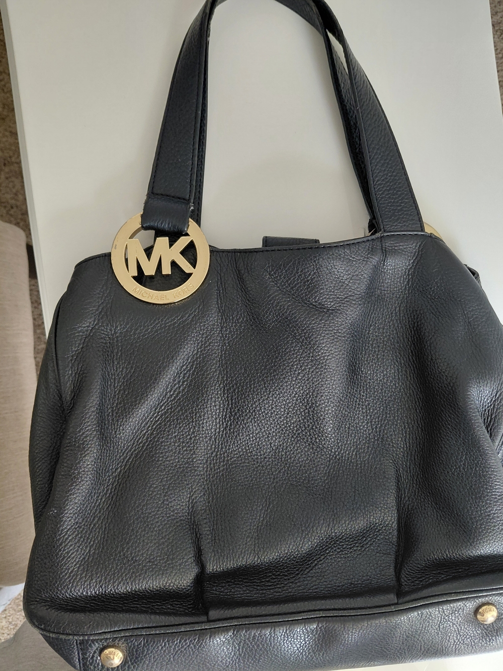 Michael Kors Black Leather Tote with Gold MK Pendant
